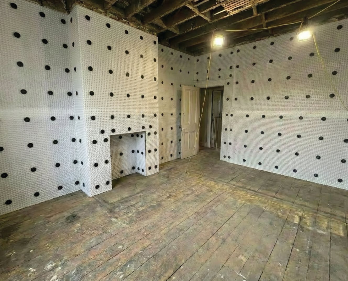 Damp-proof membrane installed across the walls before re-plastering