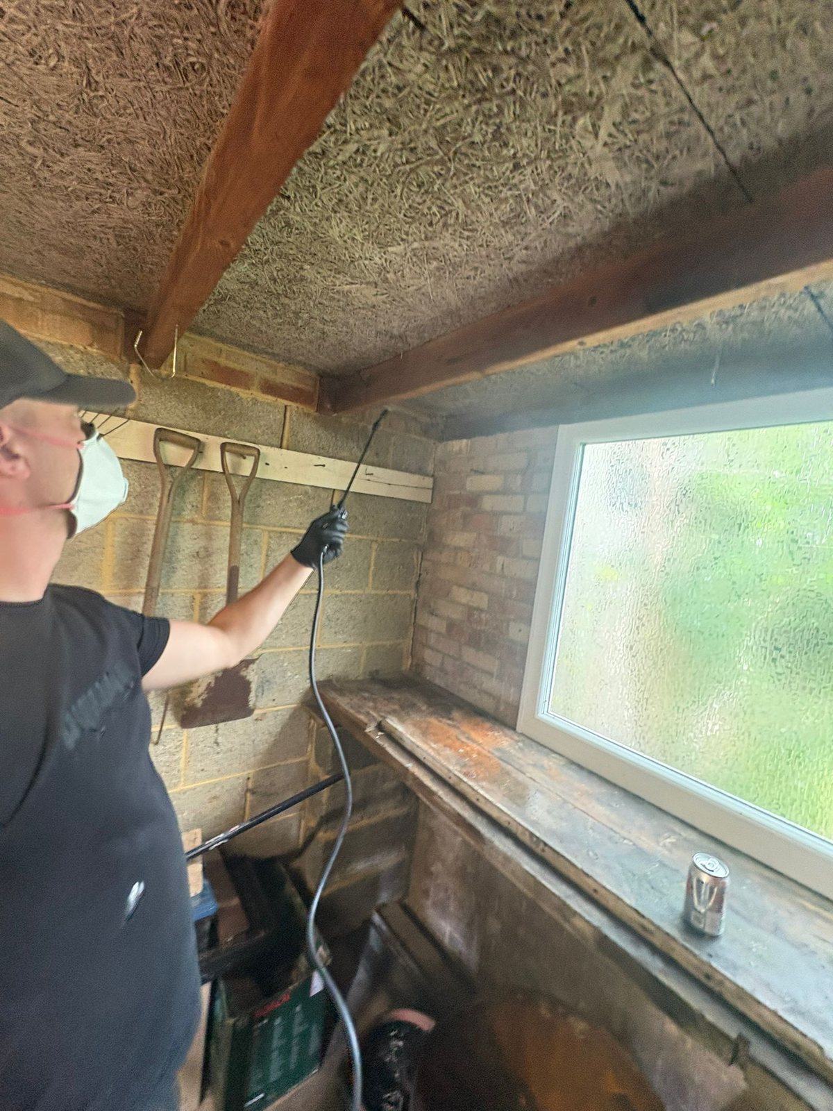 Damp-proof course cream being injected into drilled mortar beds
