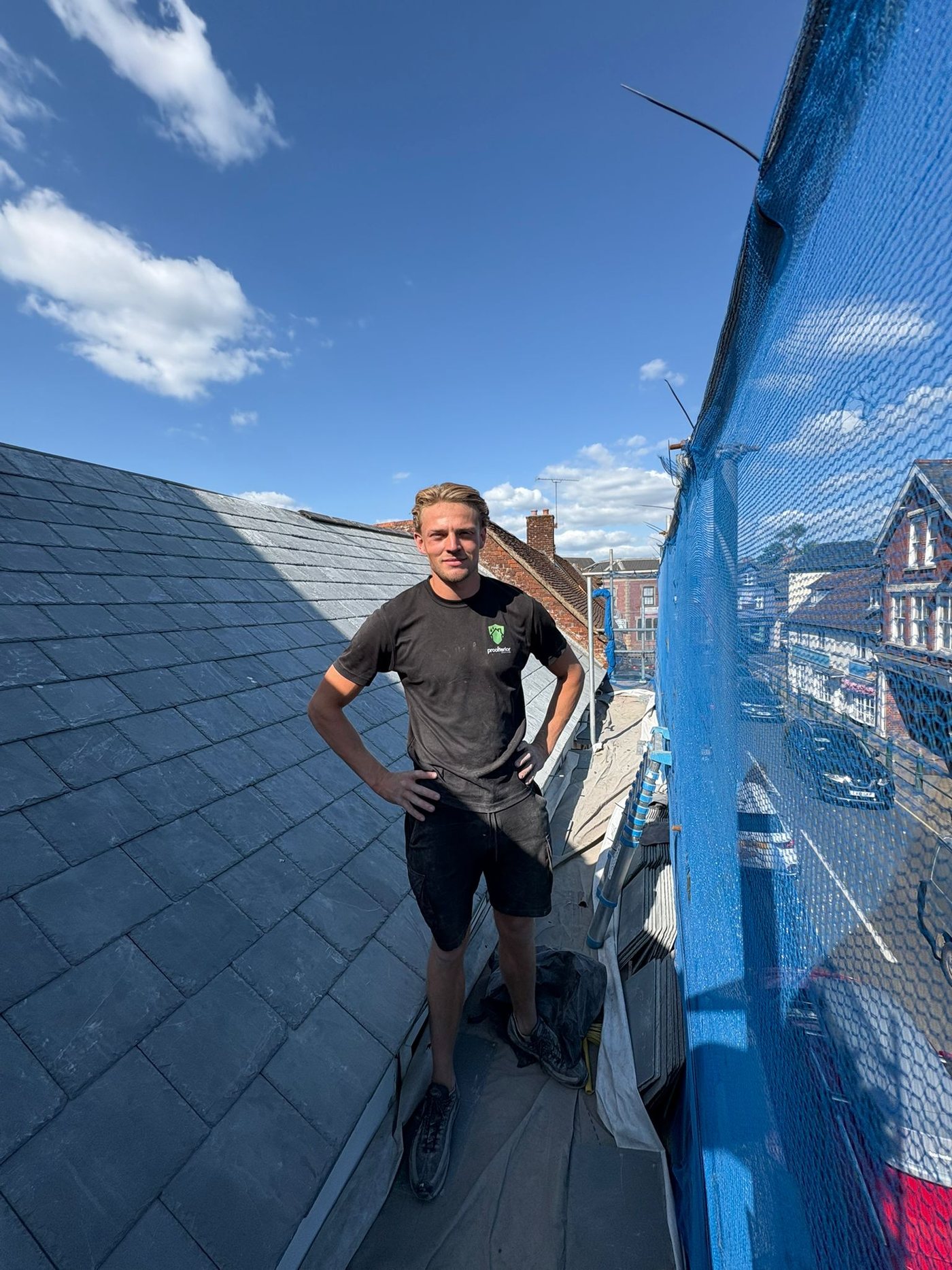 Roof repair works underway on a pitched tiled roof