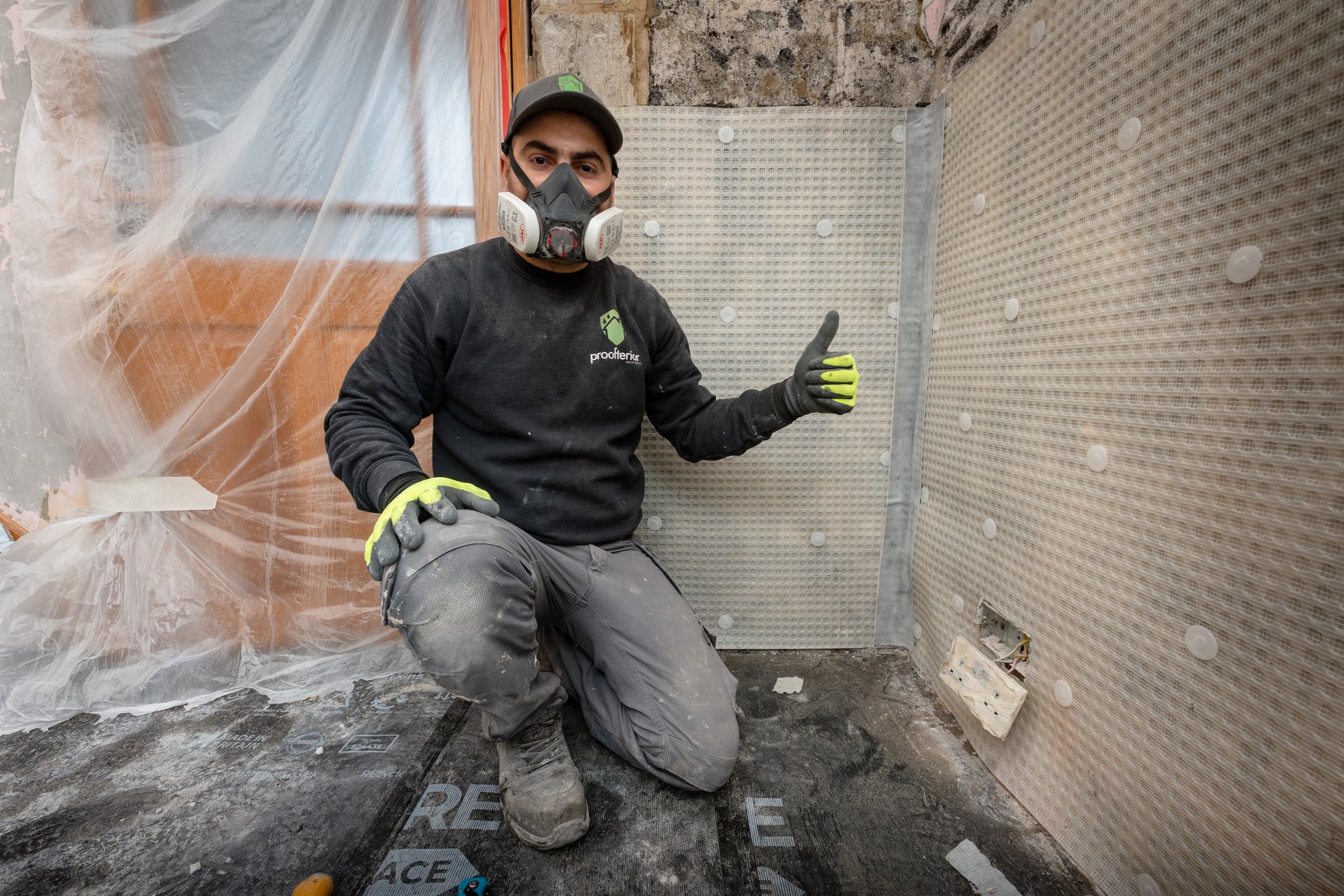 Surveyor taking readings during a damp survey